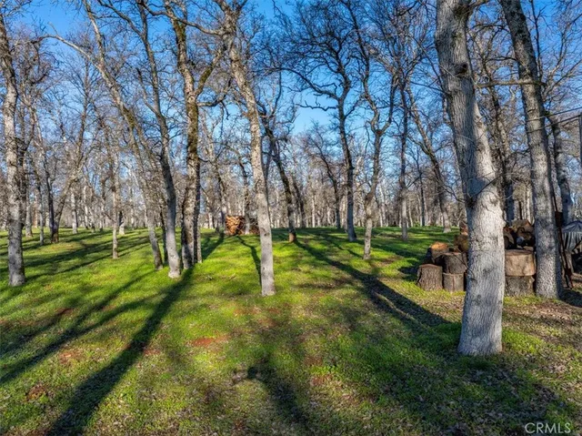 a view of a porch with a floor to ceiling window and wooden fence