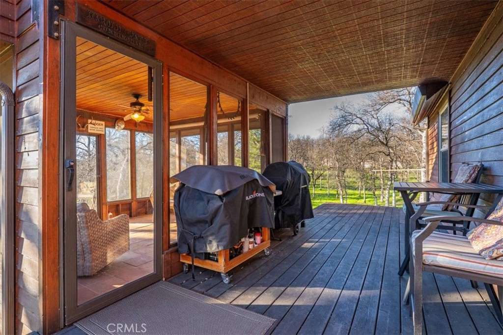 18810 Phyllis Road Cottonwood, CA 96022 - Photo 61 of 71 a living room filled with furniture and a floor to ceiling window