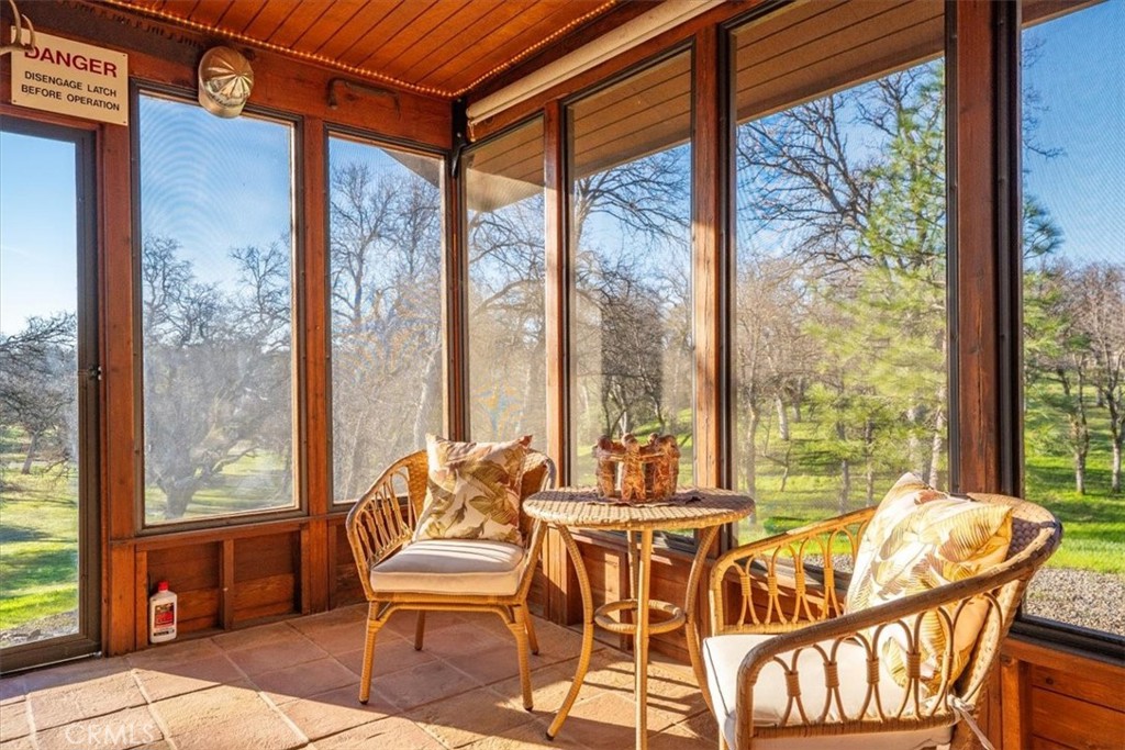 18810 Phyllis Road Cottonwood, CA 96022 - Photo 63 of 71 a dining room with furniture and large windows