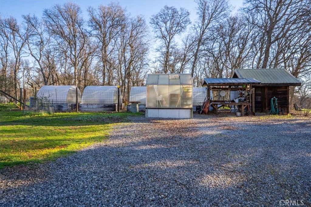 18810 Phyllis Road Cottonwood, CA 96022 - Photo 66 of 71 a view of a house with backyard and sitting area