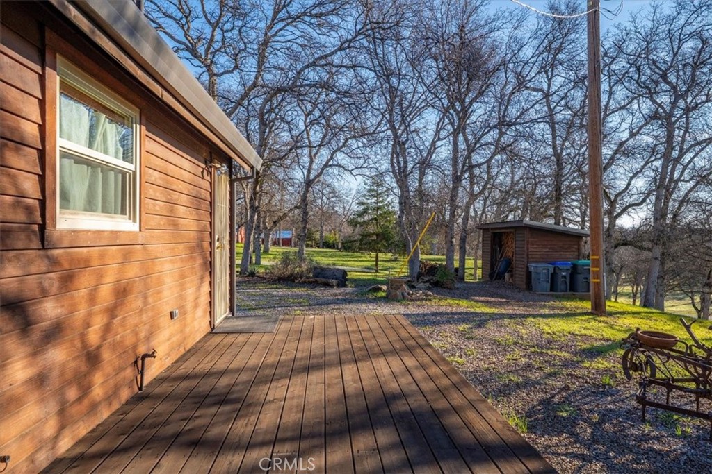 18810 Phyllis Road Cottonwood, CA 96022 - Photo 67 of 71 a view of a backyard with table and chairs and a barbeque