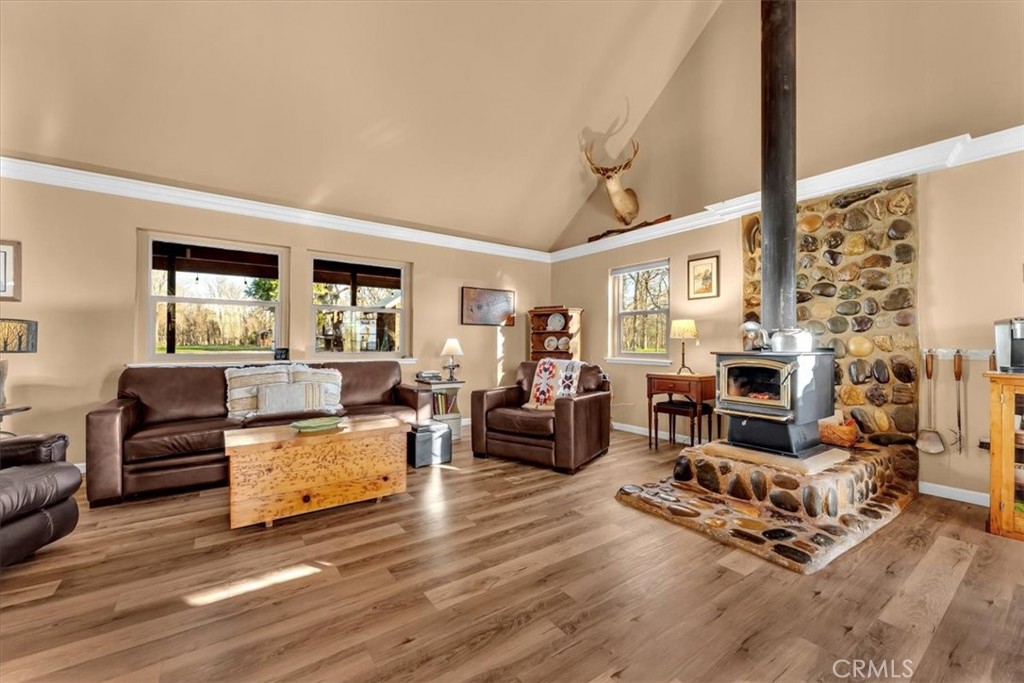 18810 Phyllis Road Cottonwood, CA 96022 - Photo 9 of 71 a living room with furniture flat screen tv and a fireplace