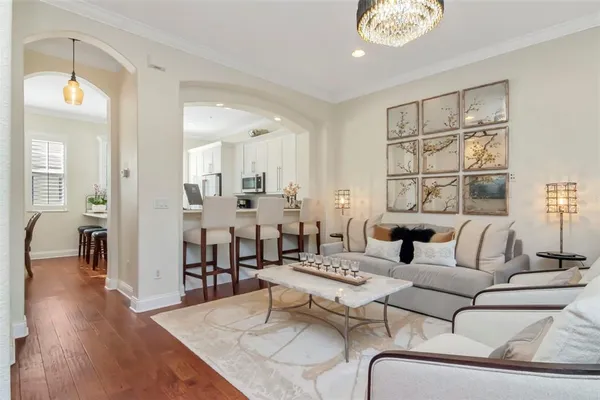 a view of living room kitchen and entryway
