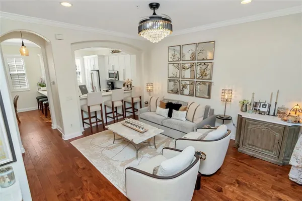 a kitchen with kitchen island white cabinets and refrigerator