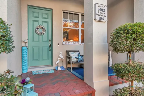 a view of an entryway with wooden floor and a rug