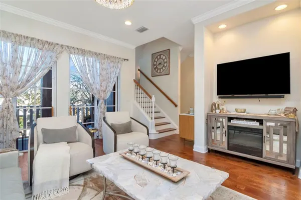 a view of a dining room with furniture window and wooden floor