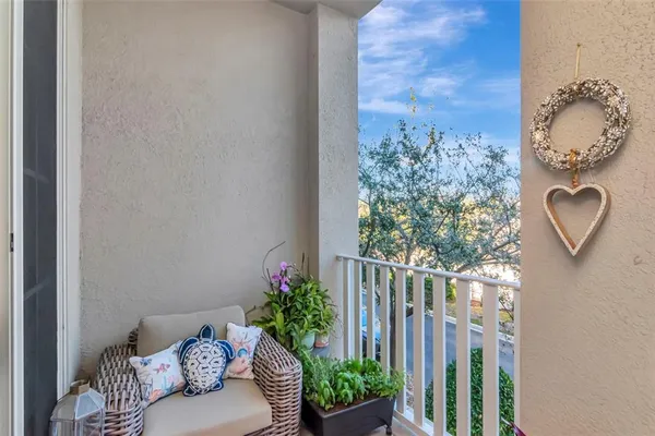 a bed room with a bed a television and a window