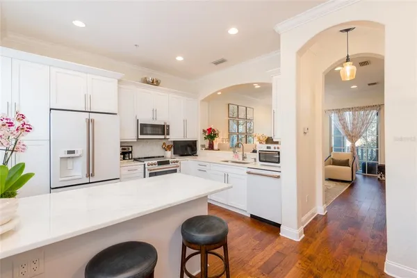 a bedroom with a bed and a couch