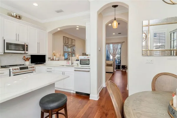a bathroom with a granite countertop sink a mirror and a shower