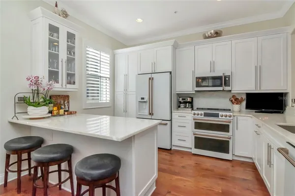 a bed room with a bed and a chandelier
