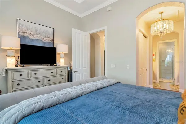 an aerial view of a city with lots of residential buildings ocean and mountain view in back