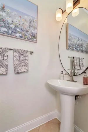 a living room with furniture wooden floor and a table