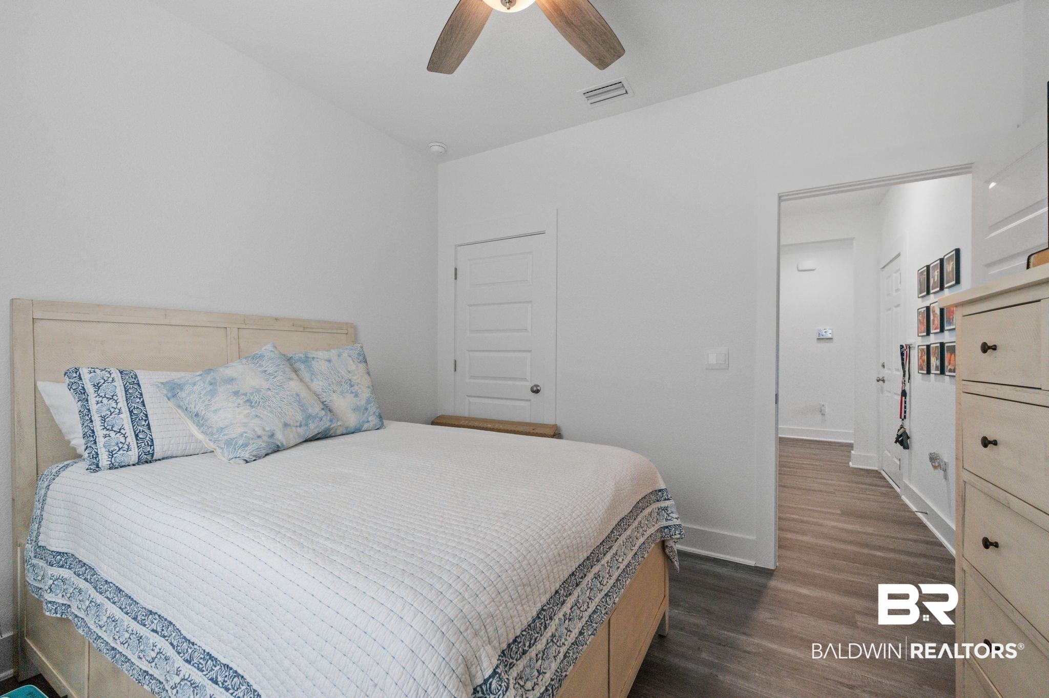 8508 Rosedown Lane Daphne, AL 36526 - Photo 8 of 29 Bedroom featuring dark wood-style flooring and ceiling fan