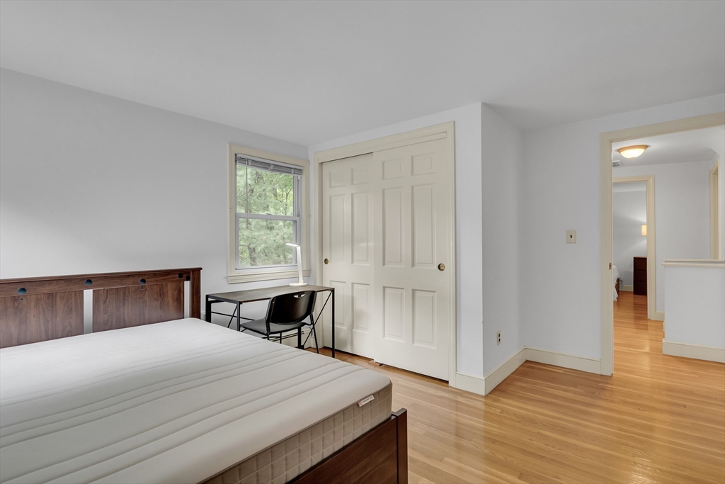 32 Dewey Road Lexington, MA 02420 - Photo 21 of 32 a bedroom with a bed and wooden floor