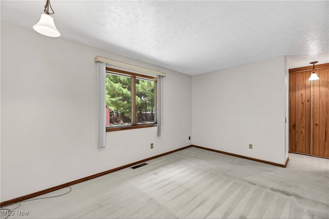 5076 North Barton Road North Ridgeville, OH 44039 - Photo 27 of 41 Bedroom with a textured ceiling and light colored carpet