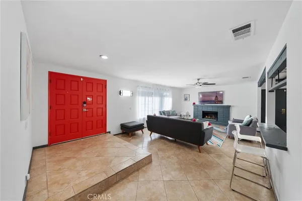 a living room with furniture and a rug