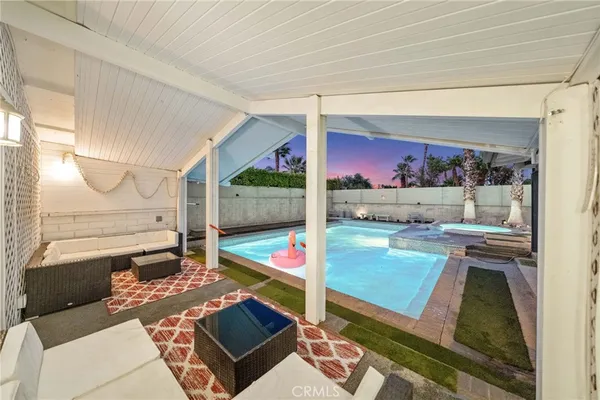 a view of a swimming pool with a lounge chairs