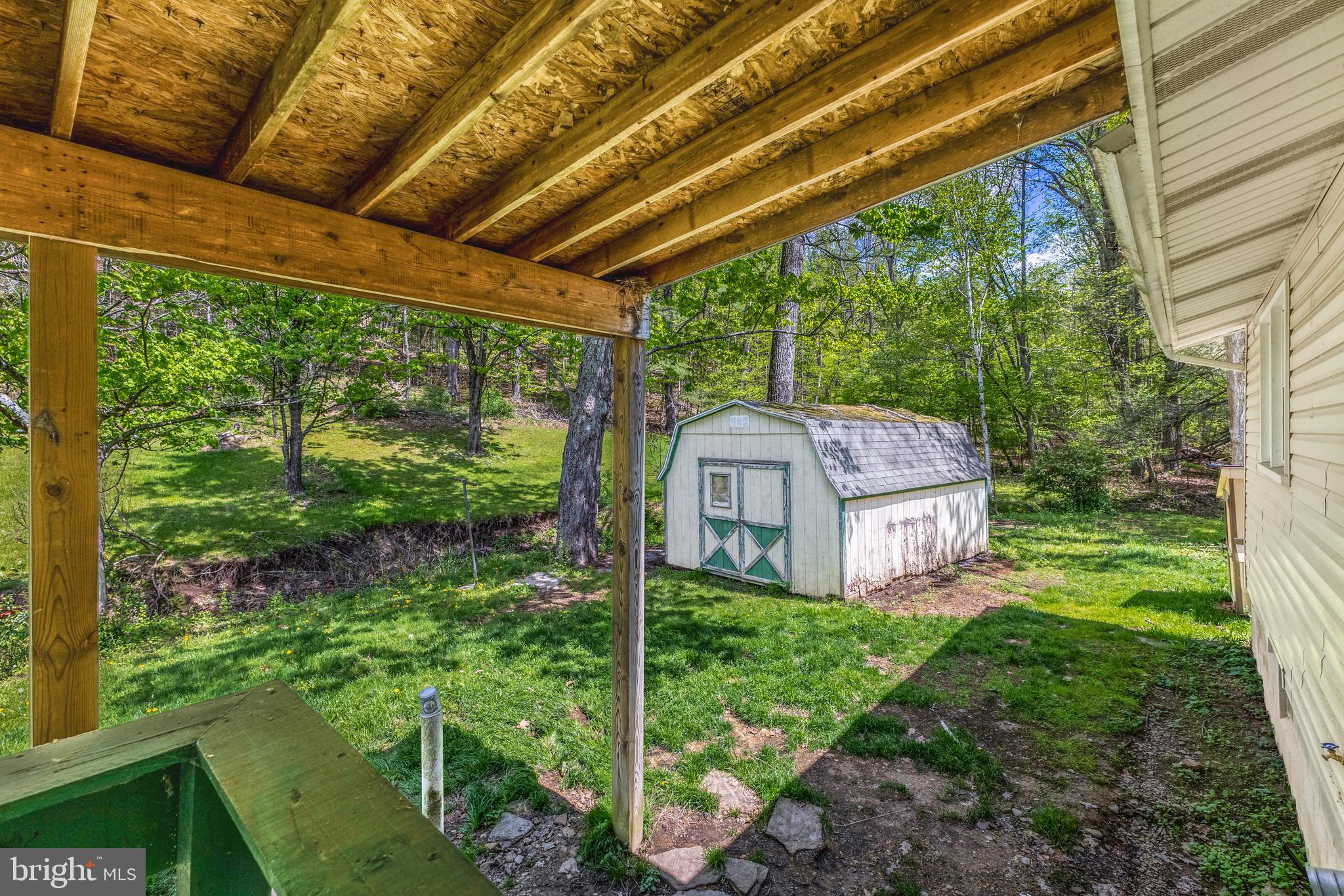 243 Lucas Road Bellefonte, PA 16823 - Photo 24 of 32 a view of a house with a backyard and balcony