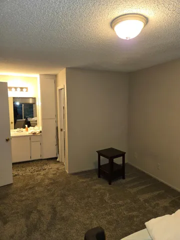 a view of a room with a small space and a window