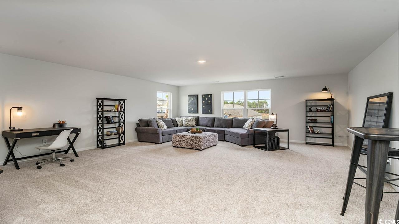 117 Keithland Drive Conway, SC 29527 - Photo 17 of 32 Living room featuring light colored carpet and baseboards