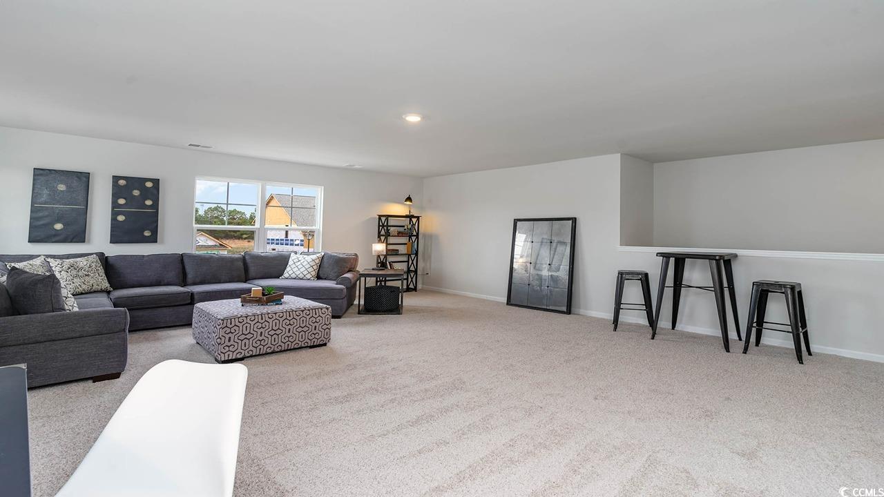 117 Keithland Drive Conway, SC 29527 - Photo 19 of 32 Carpeted living area with baseboards