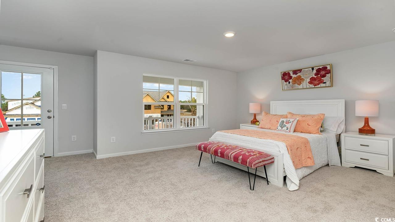 117 Keithland Drive Conway, SC 29527 - Photo 29 of 32 Bedroom with light colored carpet and multiple windows