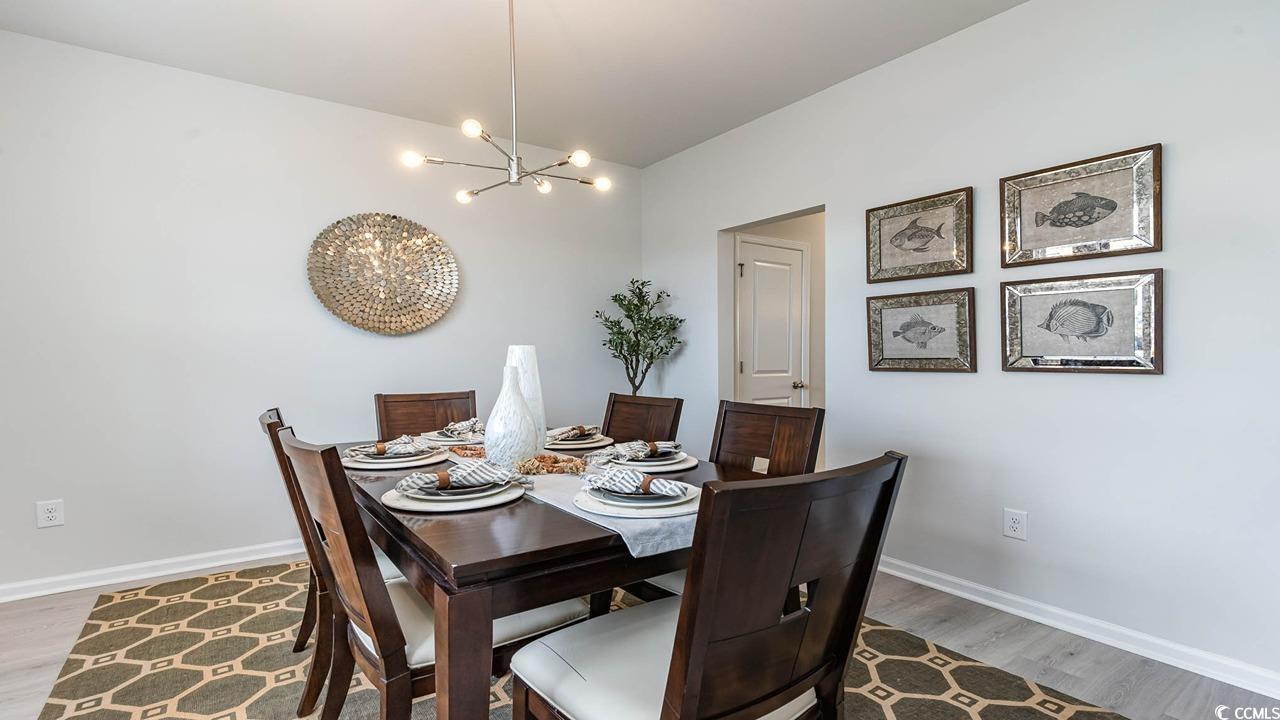 117 Keithland Drive Conway, SC 29527 - Photo 3 of 32 Dining room with a chandelier, wood finished floors, and vaulted ceiling