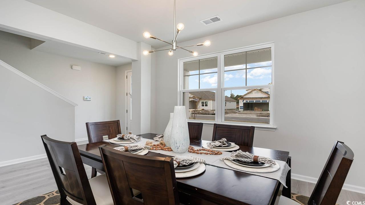 117 Keithland Drive Conway, SC 29527 - Photo 4 of 32 Dining room featuring a chandelier and wood finished floors
