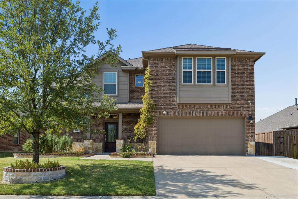 537 Hunt Farms Road Fate, TX 75189 - Photo 1 of 36 Two-story brick exterior with siding accents, an attached two-car garage, and a concrete driveway