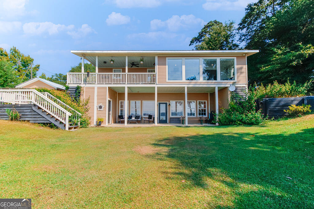 81 Docks Hook Lane Georgetown, GA 39854 - Photo 1 of 33 a view of an house with backyard and a tree