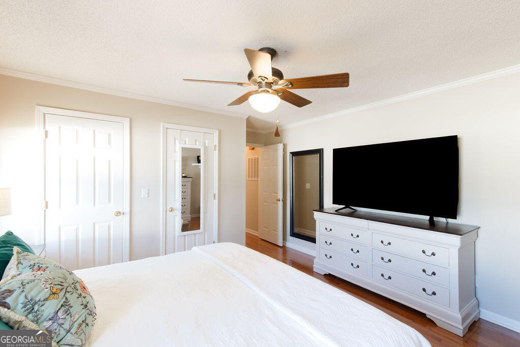 81 Docks Hook Lane Georgetown, GA 39854 - Photo 19 of 33 a bedroom with a flat screen tv and a bed