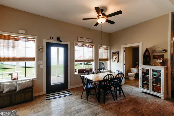 a view of a dining room with furniture window and outside view