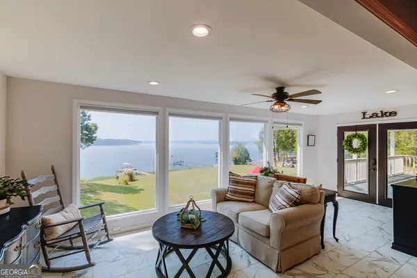 a living room with furniture and a large window