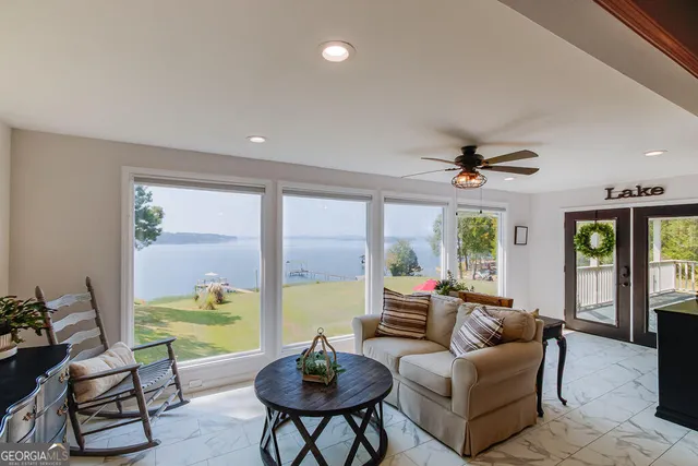 a living room with furniture and a large window