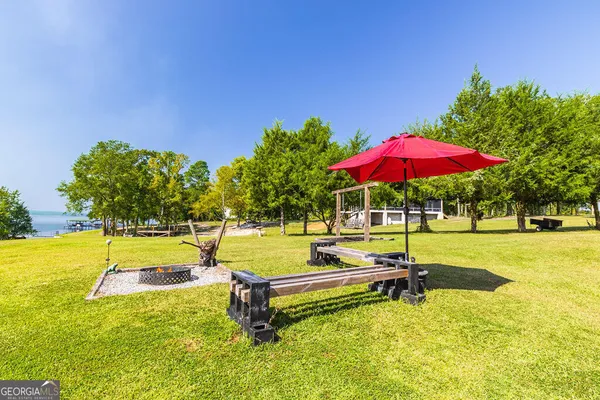 a swimming pool with lawn chairs