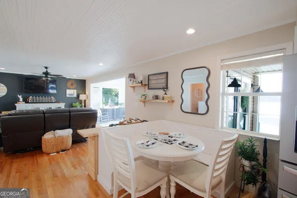 a view of a dining room with furniture and a table