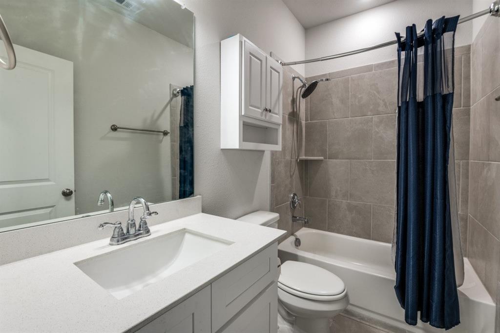 825 Heart Reef Road Plano, TX 75075 - Photo 7 of 12 Bathroom featuring vanity and shower / bath combination with curtain