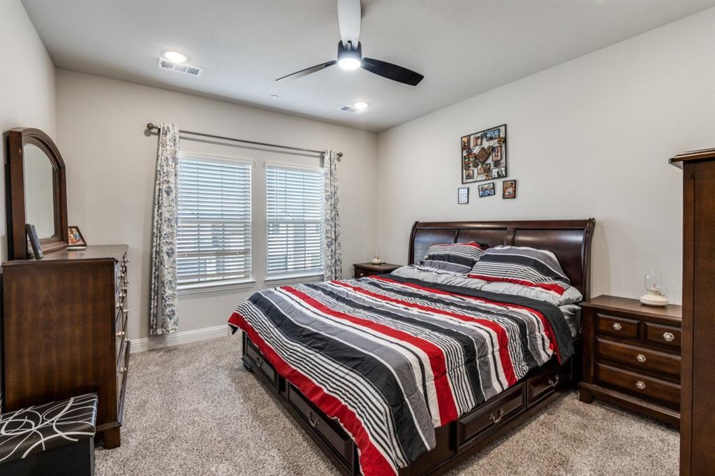 825 Heart Reef Road Plano, TX 75075 - Photo 10 of 12 Bedroom with light carpet and ceiling fan