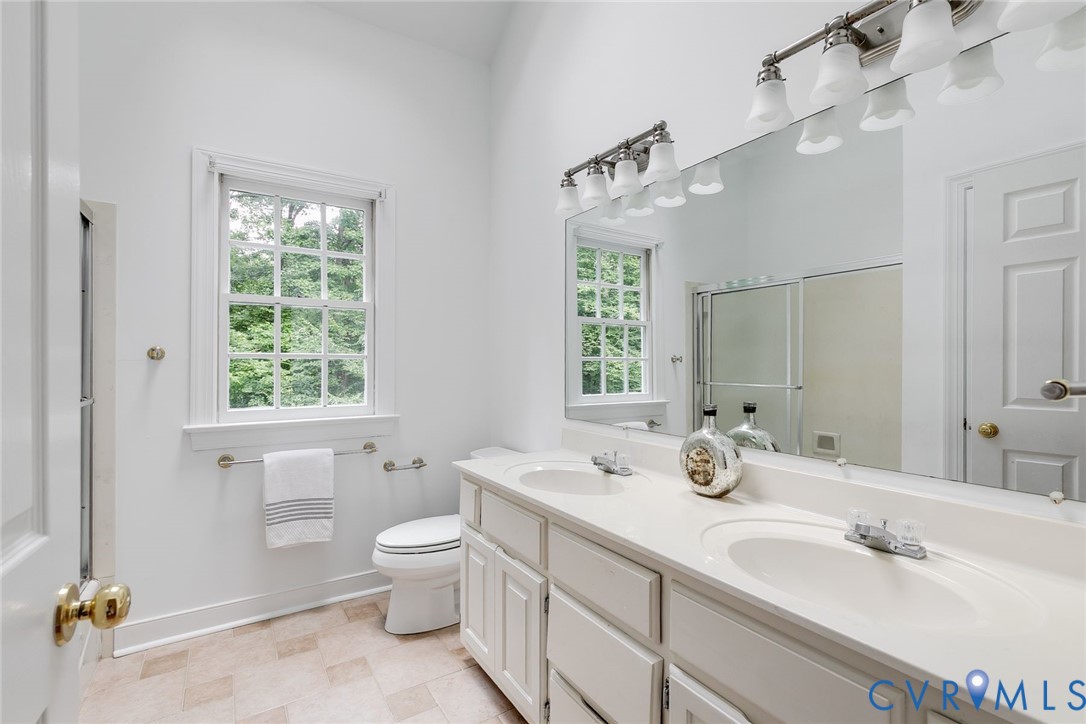 3911 Reeds Landing Circle Midlothian, VA 23113 - Photo 35 of 53 hall bathroom featuring double vanities and tub/sh