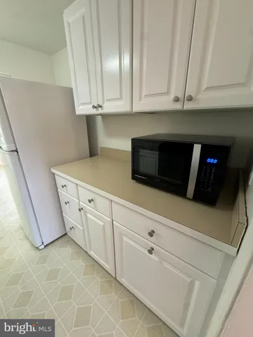 a kitchen with stainless steel appliances granite countertop a sink a stove and dishwasher