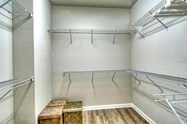 a bathroom with a shower and a sink