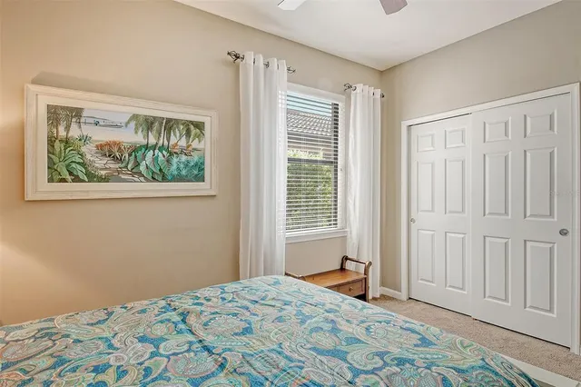 a bedroom with bed and a window