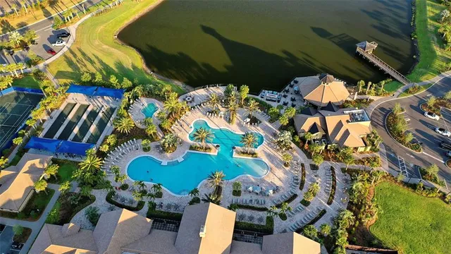 an aerial view of a house with a lake view
