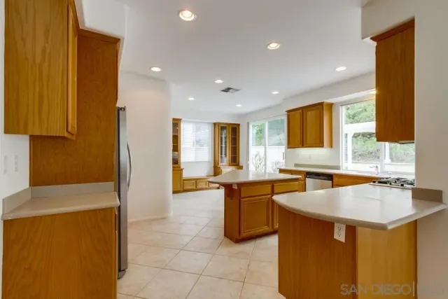 a kitchen with a sink and a refrigerator