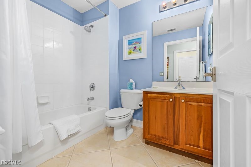 11079 Harbour Yacht Court, Unit 102 Fort Myers, FL 33908 - Photo 14 of 28 a bathroom with a toilet sink and mirror