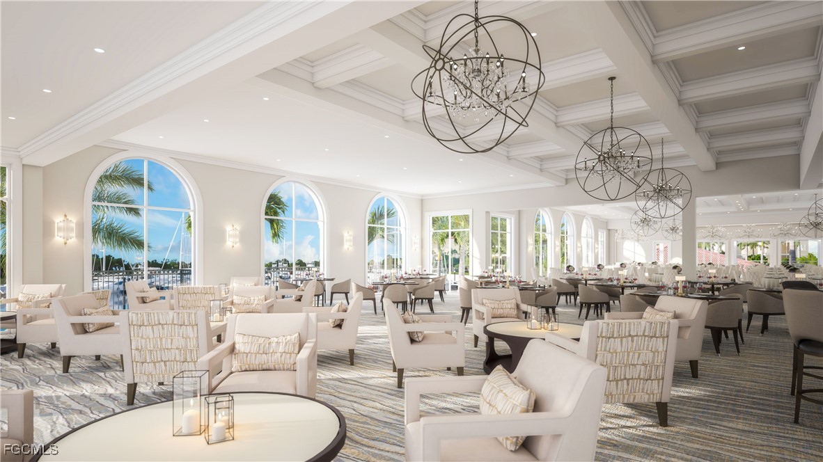 11079 Harbour Yacht Court, Unit 102 Fort Myers, FL 33908 - Photo 25 of 28 a very nice looking dining room with kitchen island furniture a chandelier and a view of living room