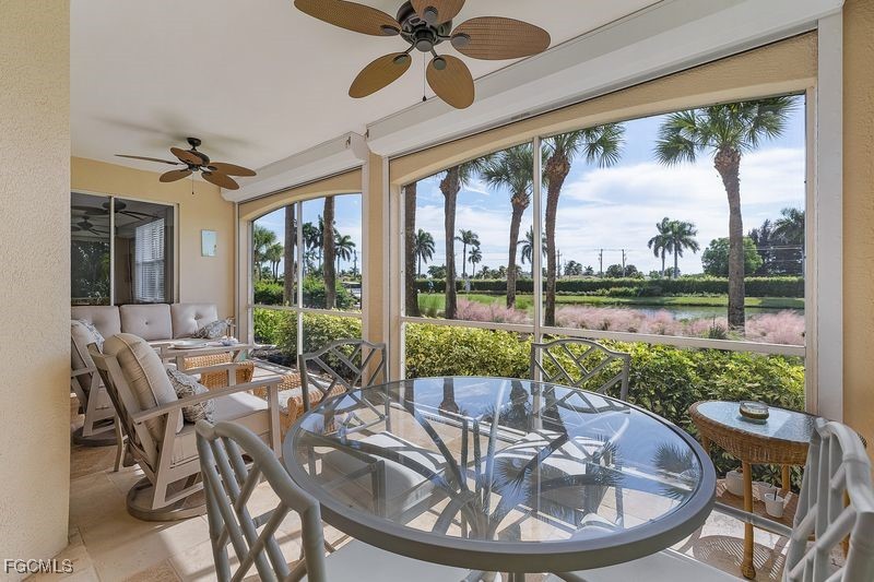 11079 Harbour Yacht Court, Unit 102 Fort Myers, FL 33908 - Photo 4 of 28 a view of a patio with couches chairs and backyard