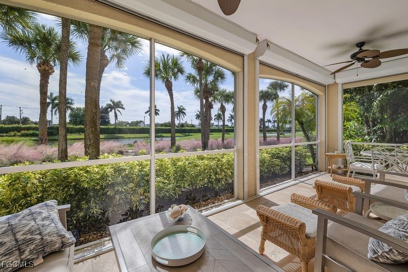 11079 Harbour Yacht Court, Unit 102 Fort Myers, FL 33908 - Photo 5 of 28 a view of a patio with couches chairs dining table and chairs