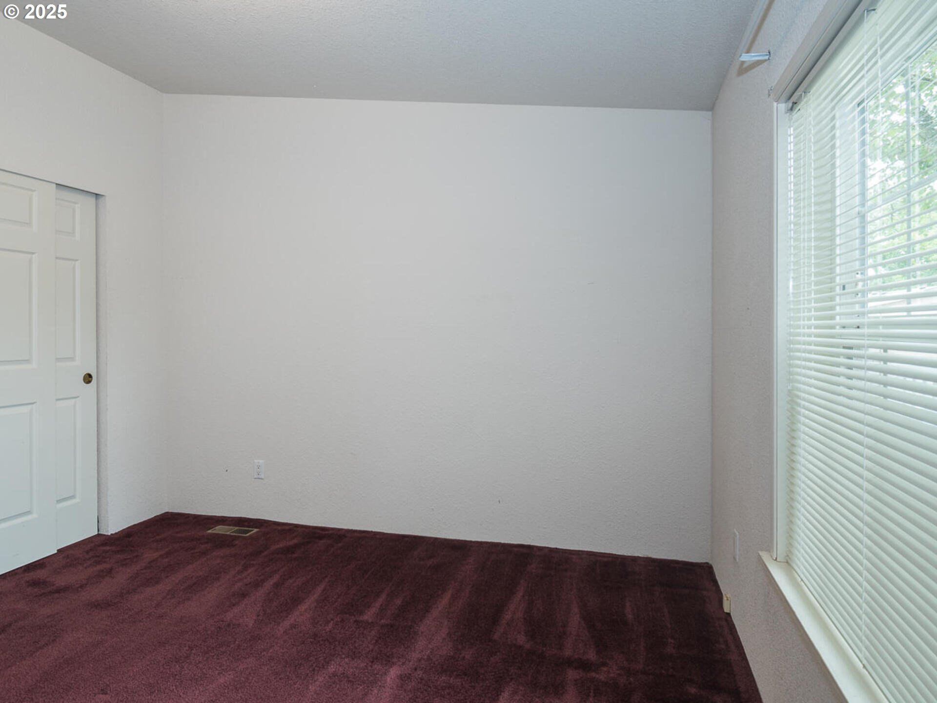 1949 Southeast Palmquist Road, Unit 91 Gresham, OR 97080 - Photo 20 of 40 a view of an empty room and window