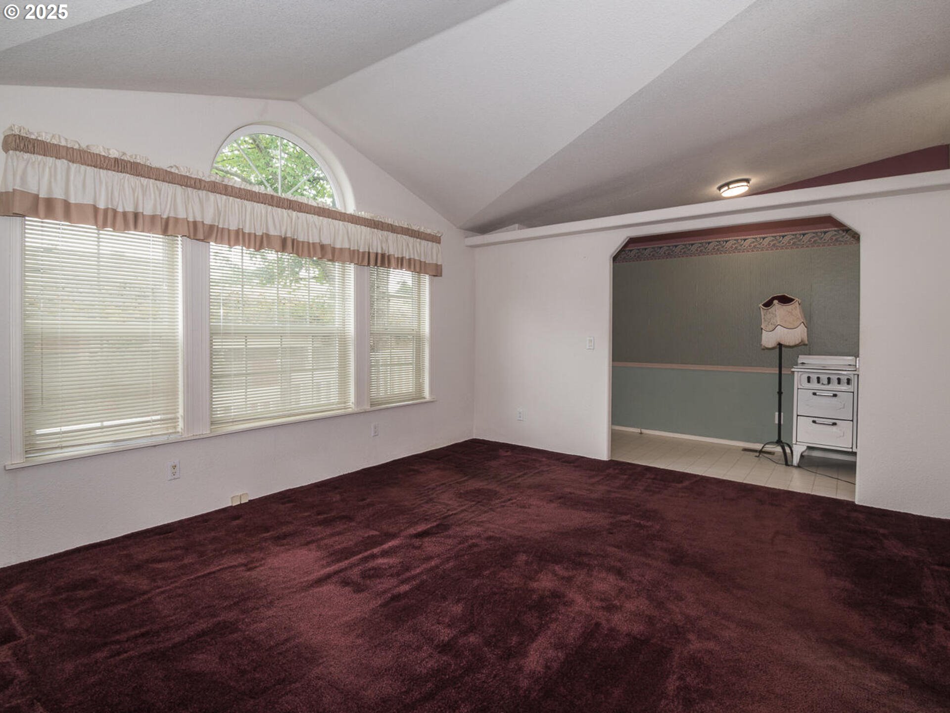 1949 Southeast Palmquist Road, Unit 91 Gresham, OR 97080 - Photo 25 of 40 an empty room with wooden floor and windows